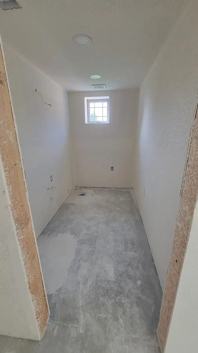Finished bathroom drywall with a Level 3 knockdown texture and recessed lighting