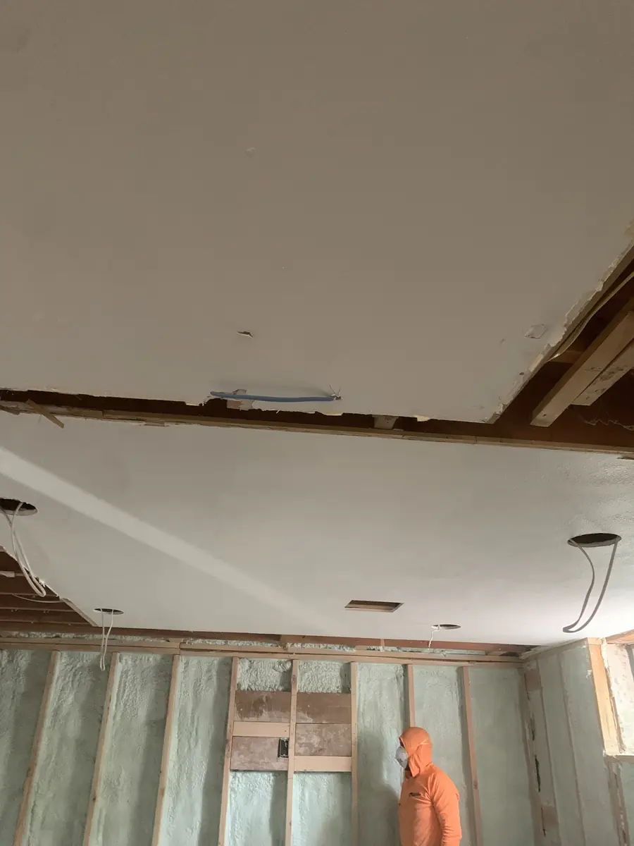 Remodel ceiling being drywalled over new spray-foam insulation